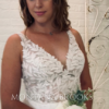 Evaded lace bodice on wedding dress worn by bride