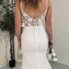 Lace back on wedding dress worn by bride who found gown on line