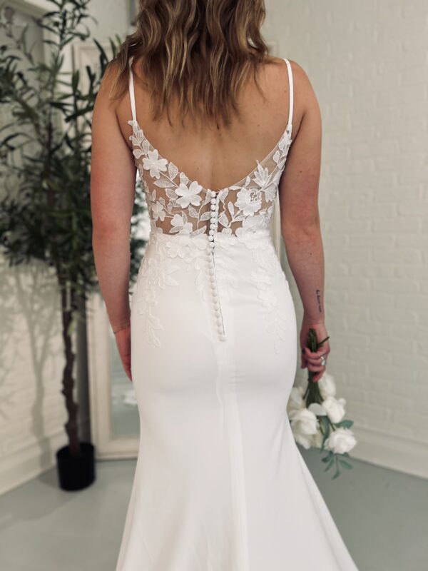 Lace back on wedding dress worn by bride who found gown on line