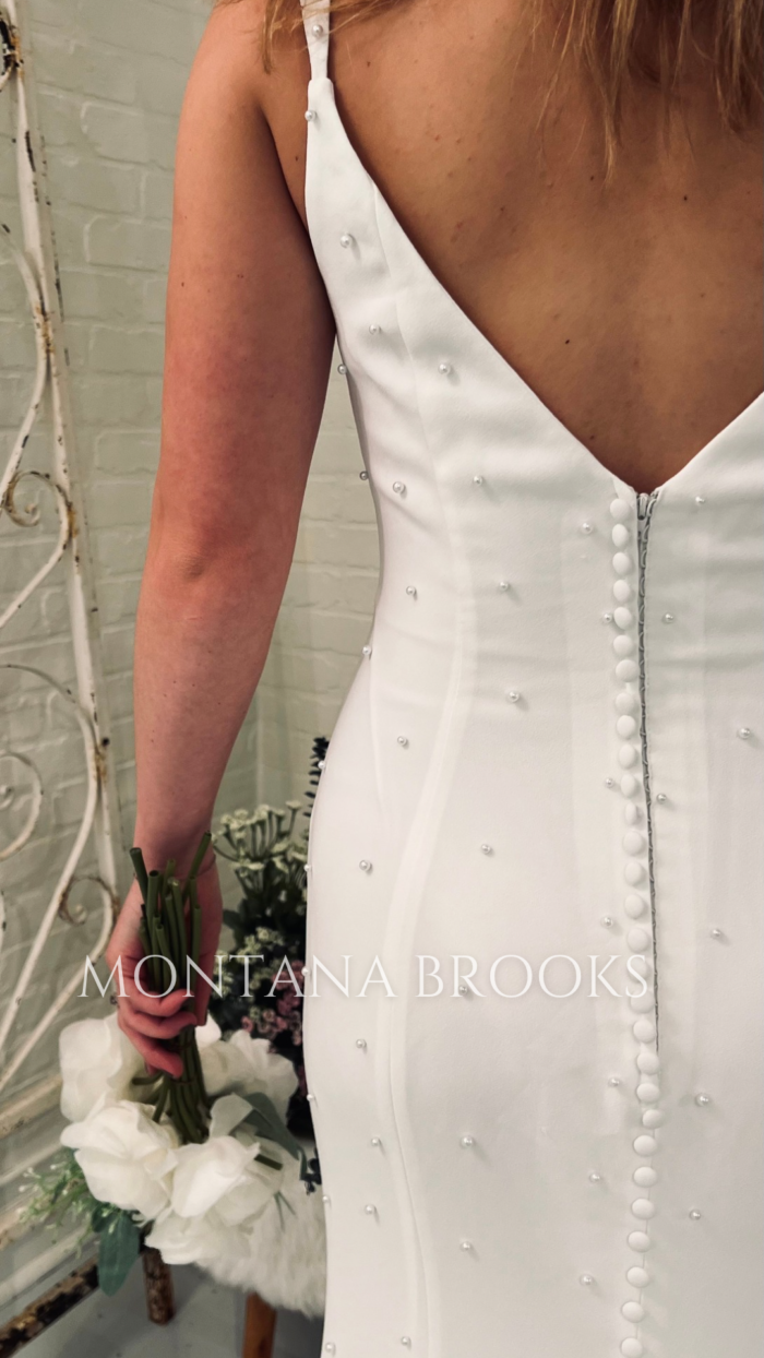 Online wedding dress with buttons down back of of entire train